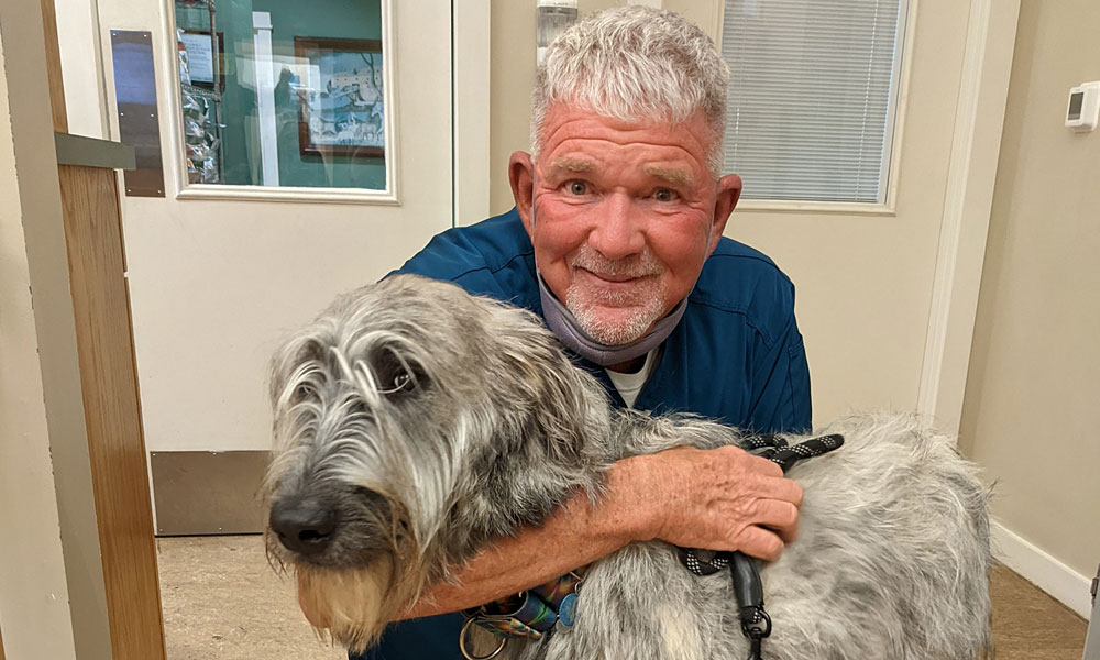 photo of Doctor McDaniel and a large dog